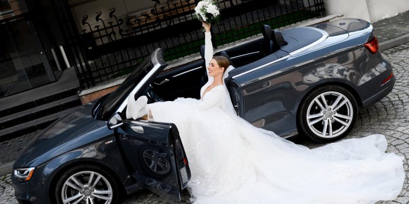 crazy-female-model-siting-car-with-bouquet